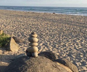 photo of rocks stacked on rocks on a beach - the business of recovery - action institute of california - jean campbell - action insights blog - psychodrama training institute in san diego california