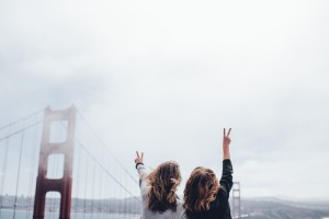 what can i say? she just gets me - women holding up peace signs - action institute of california - jean campbell