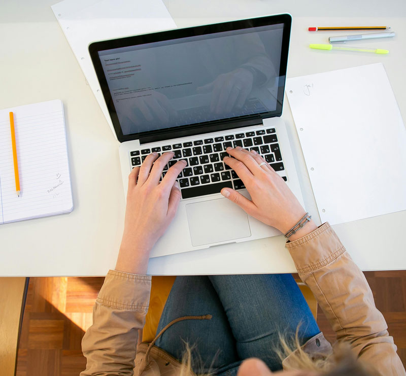 woman working on her computer preparing for an exam - exam preparation